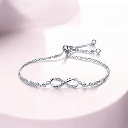 Buy Nilu's Collection Infinity Shape Cubic Zirconia Diamond Bracelet for Women, Jewelry for Gift, Adjustable Charm Bracelet (Silver) at Amazon.in